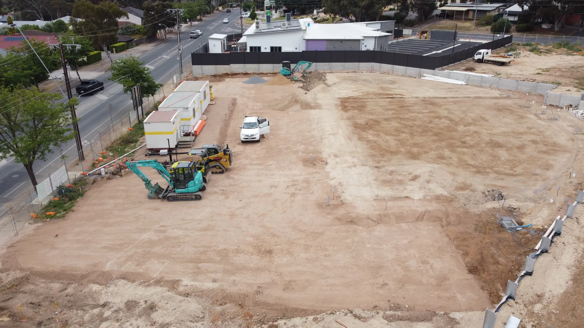 Construction site with machinery and vehicles.